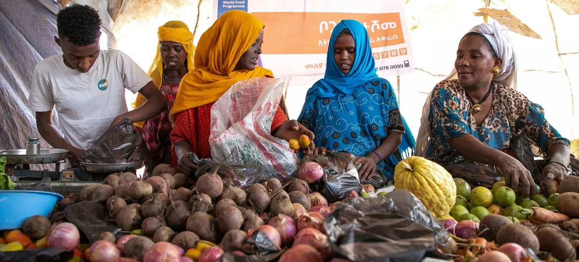 Women participating in local food systems and agricultural markets.