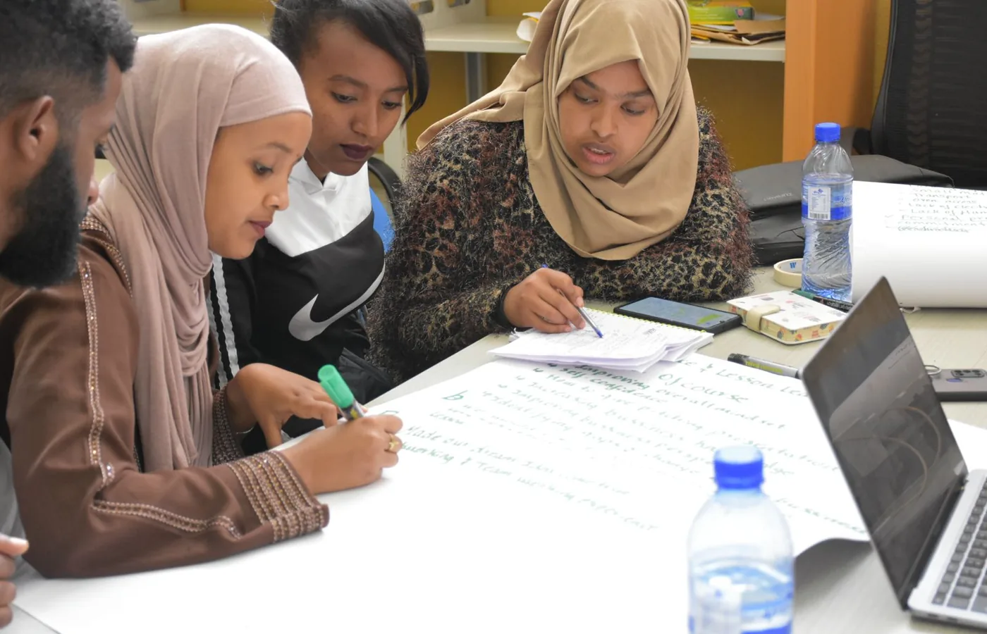 Young women participating in a learning and incubation session